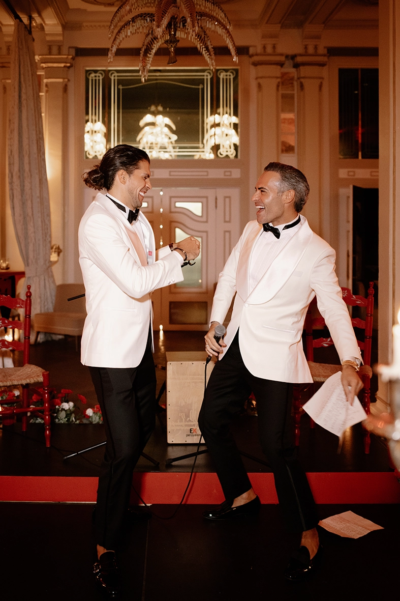 grooms laughing and celebrating during wedding in Mallorca