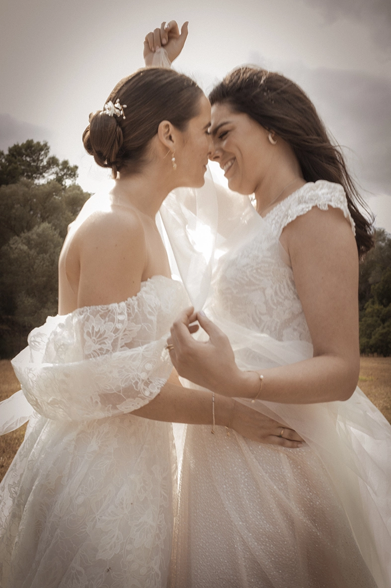 two brides embracing during wedding in Mallorca