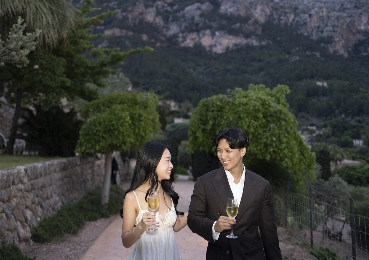 Couple celebrating a marriage proposal at Belmond La Residencia with champagne in Deià