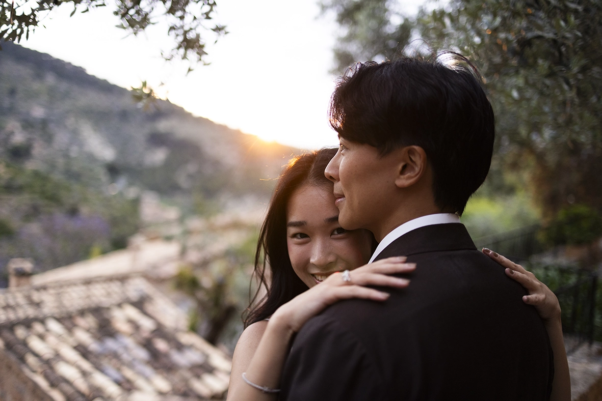 Romantic sunset embrace during a marriage proposal at Belmond La Residencia Deià