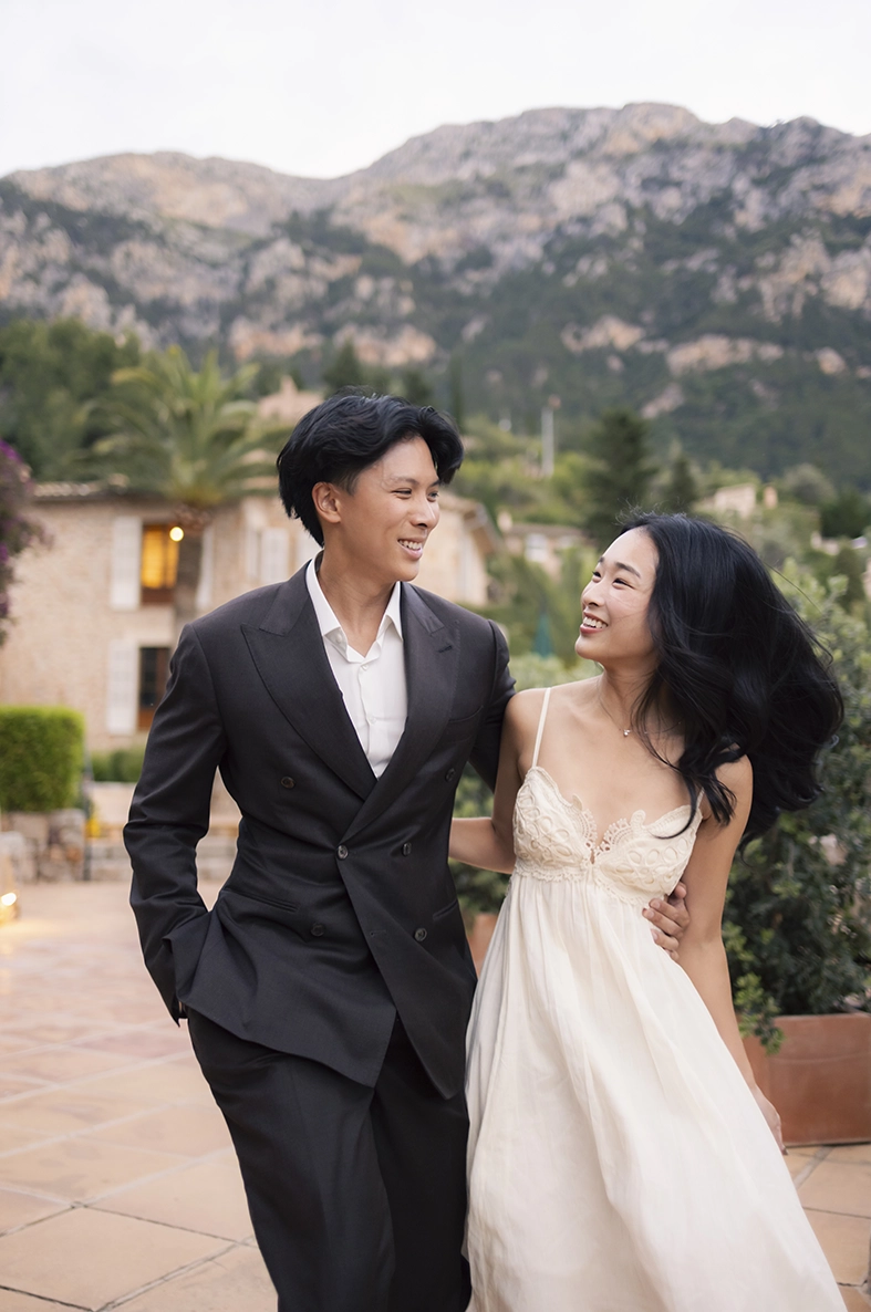 Elegant couple walking together after a marriage proposal at Belmond La Residencia Deià