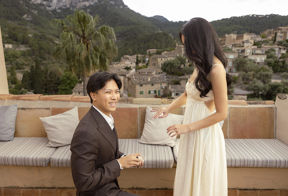 Emotional marriage proposal at Belmond La Residencia Deià with Jun smiling while proposing to Fey in Mallorca