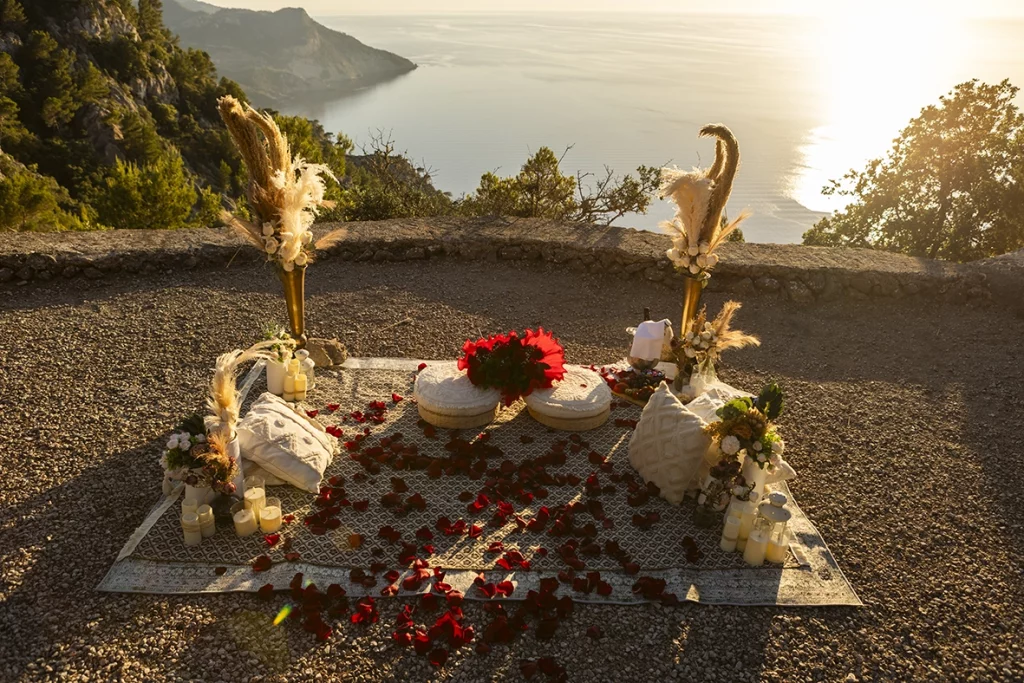 Romantic proposal setup overlooking the Mediterranean Sea at sunset in Mallorca.