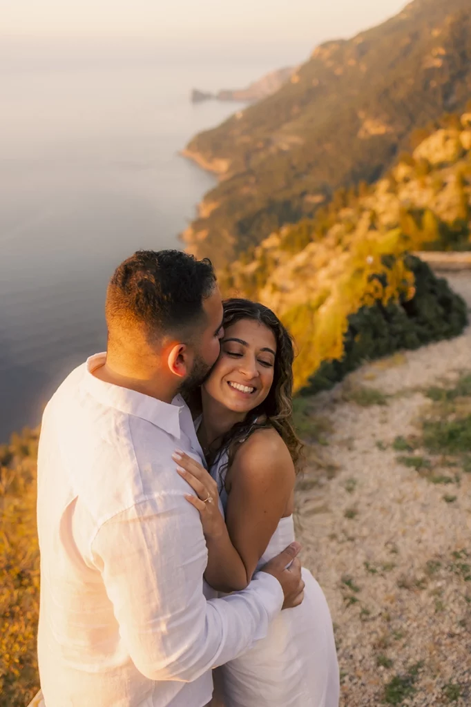 Romantic close up of a couple embracing during sunset after a surprise proposal in Mallorca photographed by Inma del Valle