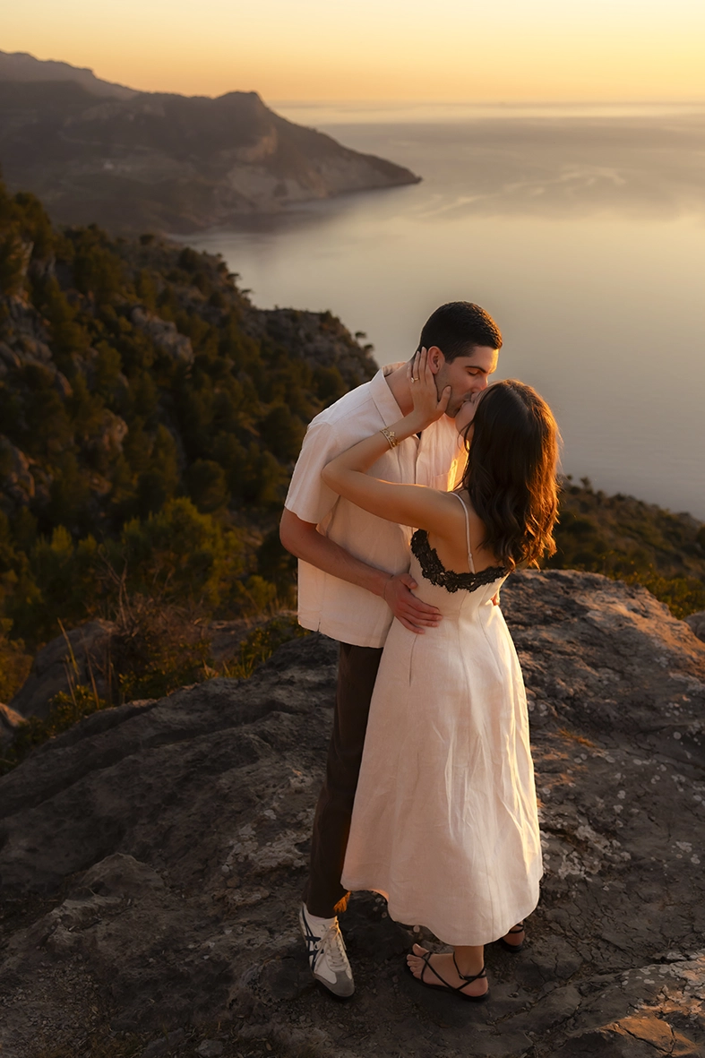 Engaged couple kissing at sunset during an engagement photoshoot in Mallorca