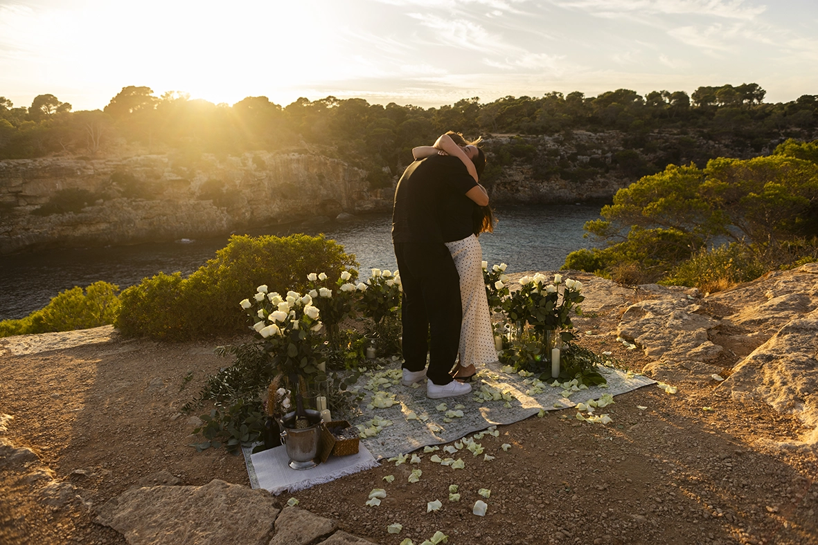 A heartfelt embrace after a sunset proposal at one of the best places to propose in Mallorca. Photo by Inma del Valle.