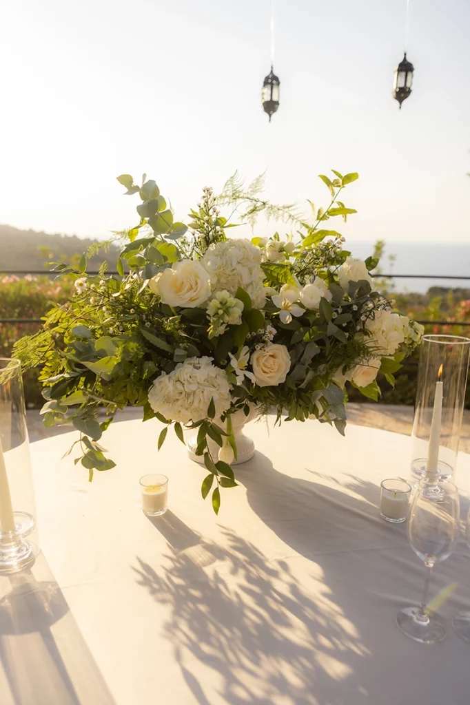 White floral arrangement prepared for a romantic proposal at Belmond La Residencia overlooking the Mediterranean in Deià, Mallorca.