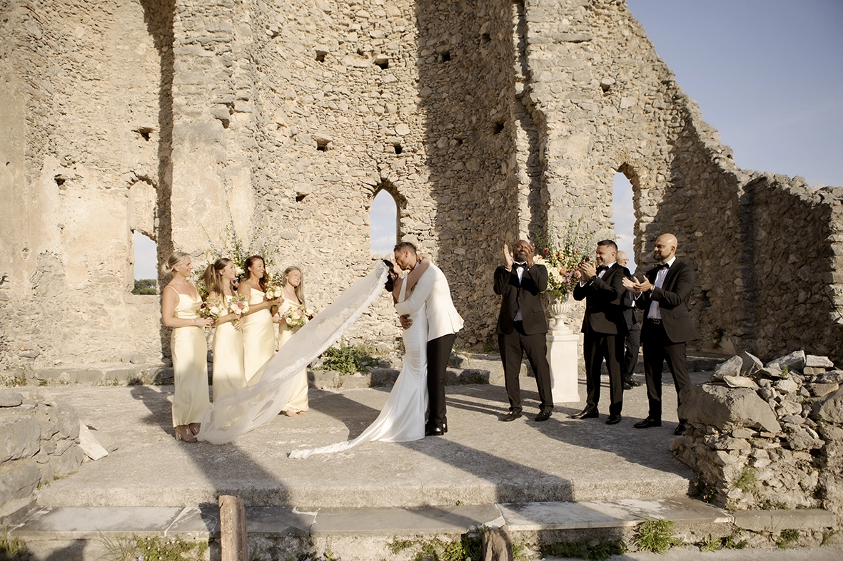 Bride and groom kissing during their wedding ceremony at the historic San Eustachio Church in Scala on the Amalfi Coast.
