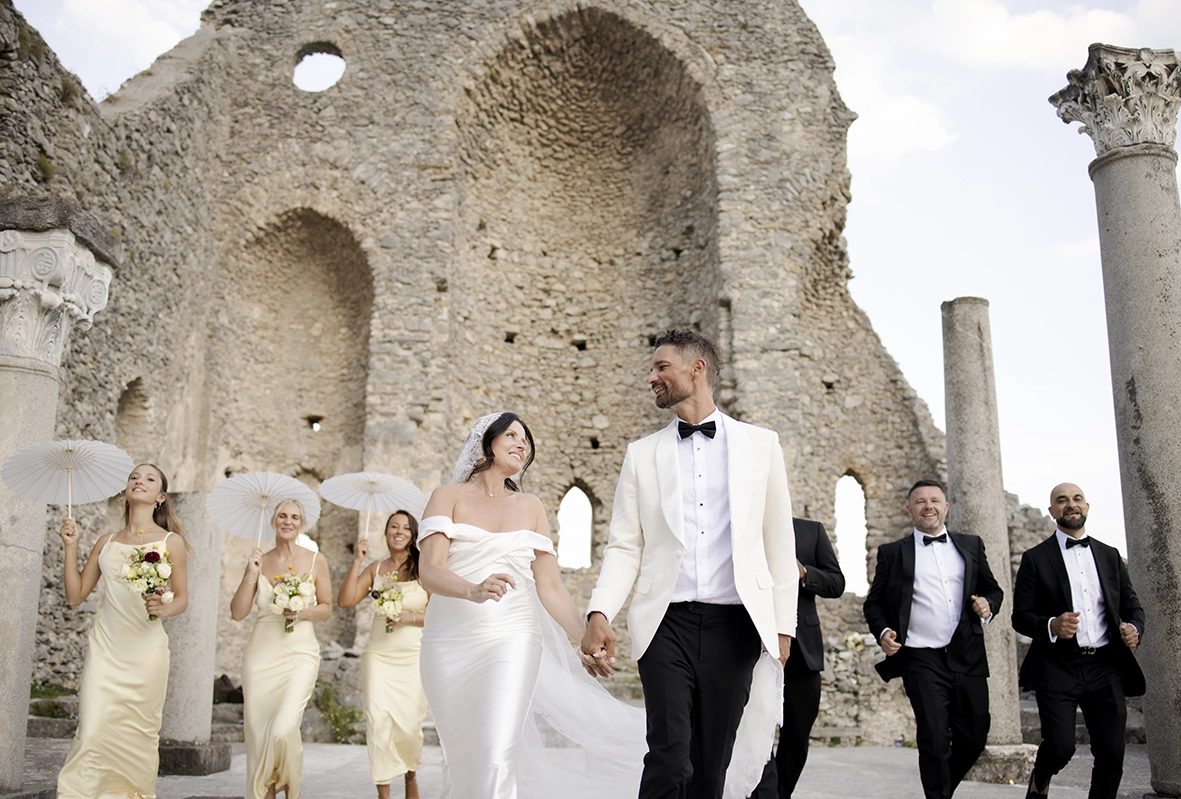 Newlyweds walking after their ceremony at the Church of Sant’Eustachio, photographed by an Amalfi Coast wedding photographer.