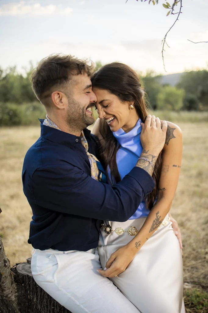 Anto and Biel hugging and laughing during their pre-wedding session in Mallorca.