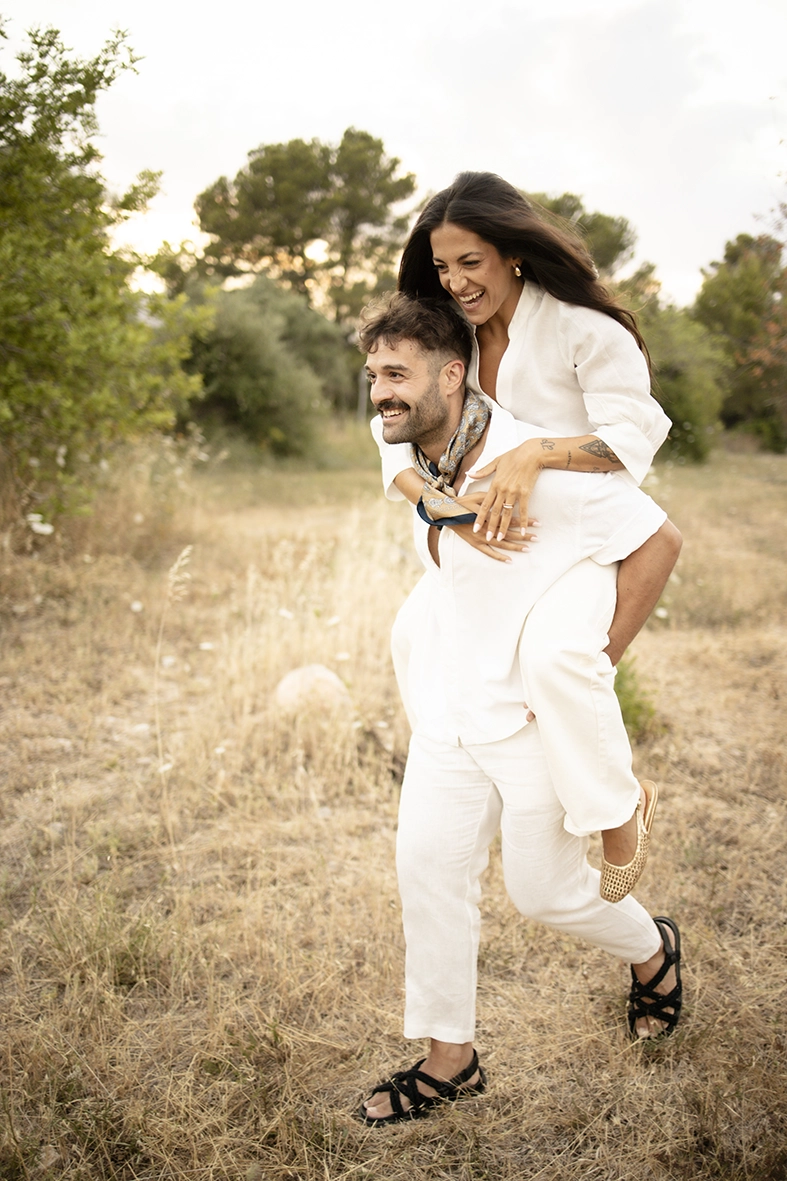 Anto riding on Biel’s back during a playful pre-wedding photoshoot in Mallorca.
