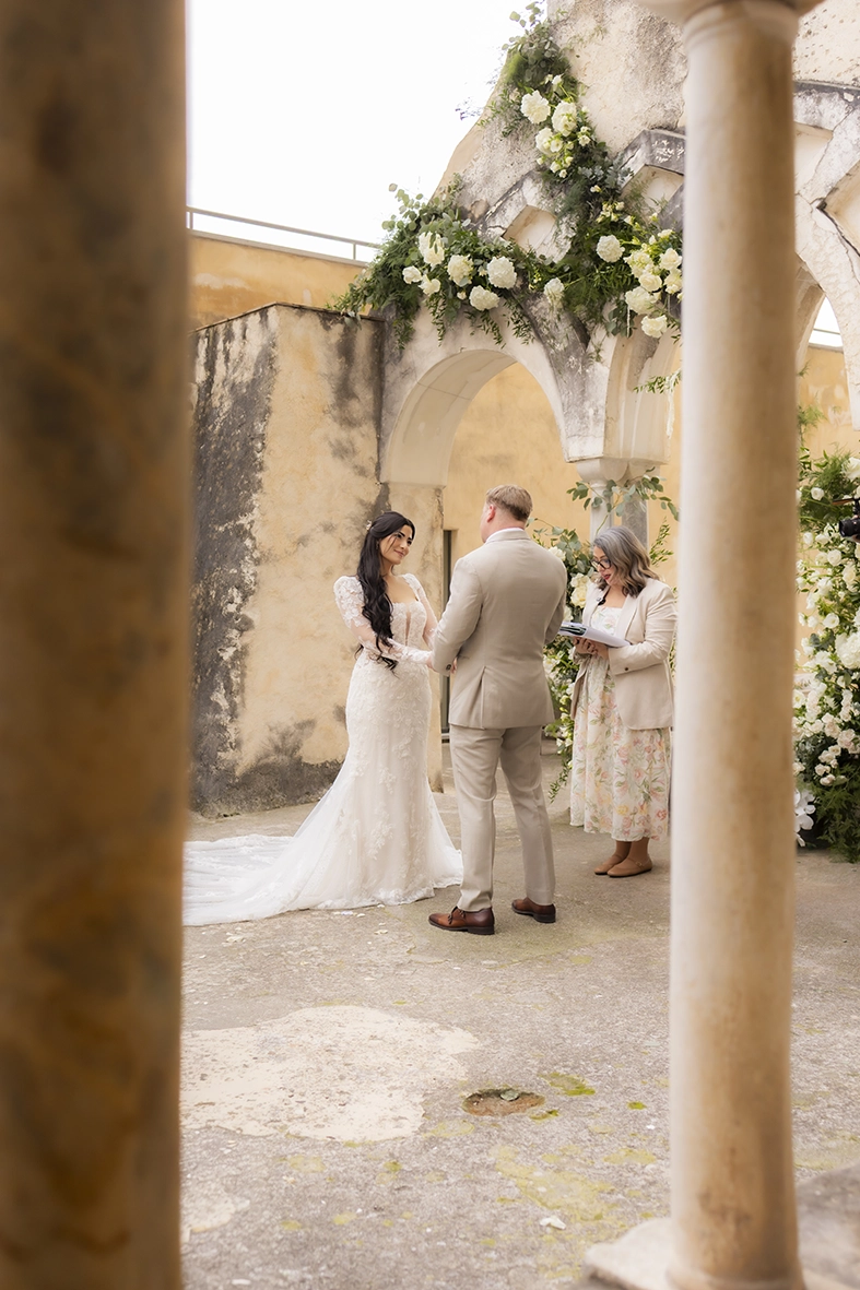 Bride and groom exchanging vows during their intimate wedding ceremony at Anantara Convento di Amalfi.